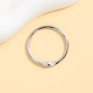 Silver metal binder ring loose leaf ring keychain loop DIY craft accessory for bags and planners.