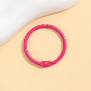 Pink metal binder ring and keychain accessory, ideal for DIY crafts, bag pendants, and organizing.