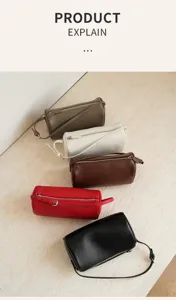 Detail view of stylish cylinder shoulder bags in multiple colors, soft leather texture.