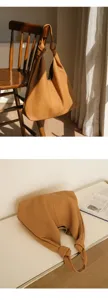 Brown soft leather hobo bag with knotted handle, chic casual tote and elegant underarm bag.