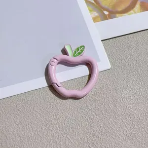 Pink apple spring ring keychain detail, cute metal baking-paint DIY jewelry hanging accessory.