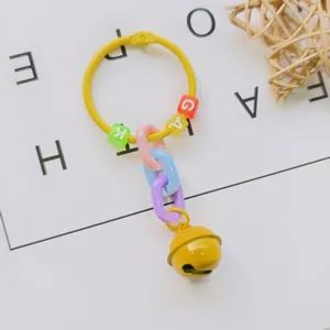 Creative DIY bell keyring and bag charm with colorful pastel chains and letter beads.