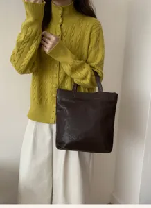 Detailed view of the stylish dark brown leather tote bag, perfect for everyday casual wear.