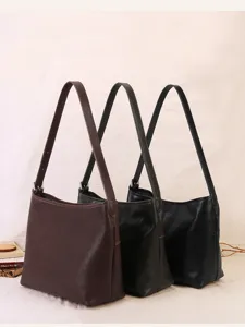 Detailed view of casual slouchy PU leather shoulder bag for women, soft daily commuter hobo bag.