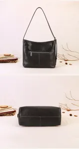 Detailed view of the dark brown leather shoulder bag showcasing texture and bottom structure.