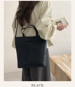 Minimalist solid color large capacity tote bag for women, stylish shoulder handbag.