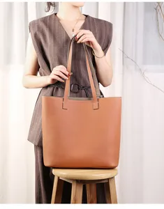 Detailed view of the premium leather double-sided tote bag showing fine texture and craftsmanship.