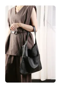 Black genuine leather shoulder bag for women, large capacity slouchy hobo tote for daily commute.