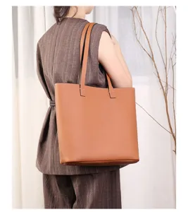 Brown genuine leather tote bag detail view, large capacity casual shoulder bag.