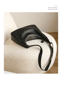 Minimalist black leather shoulder bag, chic underarm handbag for women daily commute.