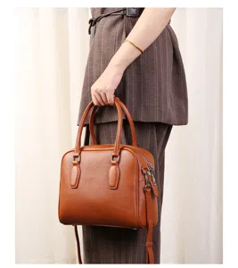 Brown leather Boston handbag for women, casual commuting top handle shoulder bowling bag.