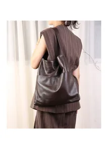 Vintage large capacity leather shoulder bag for women, stylish commuting tote and underarm bag.