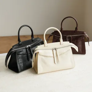 Vintage genuine leather handbag with woven detail and zipper closure, retro style women shoulder bag.