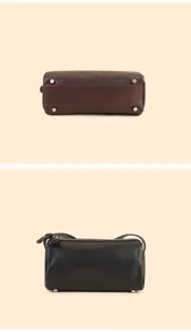 Detail view of genuine leather cylindrical pillow bag showing bottom studs and side profile.