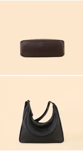 Leather hobo shoulder bag detail view, showing bottom structure and slouchy shape design.