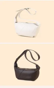 Detailed view of women soft leather dumpling shoulder bag, showcasing fine texture, stitching.