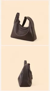 Brown leather hobo shoulder bag detail view, large capacity casual commuting tote bag style.