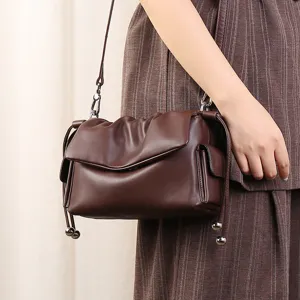 Trendy genuine leather pleated underarm shoulder bag with minimalist drawstring cloud design.