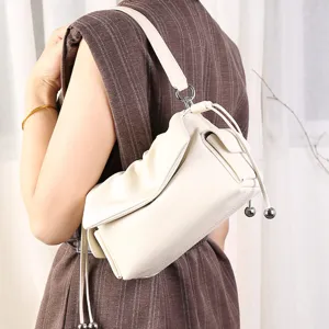 Trendy white pleated shoulder bag underarm cloud bag with drawstring and chic metallic ball decor