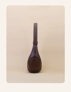 Brown leather underarm shoulder bag for women, stylish teardrop design with contrast stitching.
