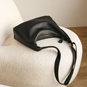Classic black leather hobo shoulder bag for women, large capacity daily casual commute handbag.