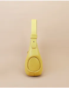 Yellow leather crescent shoulder bag, stylish minimalist daily commute handbag for women.