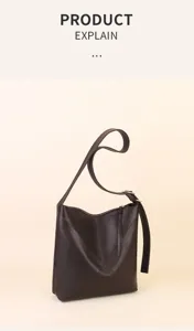 Dark brown genuine leather bucket bag, stylish minimalist design with adjustable strap.