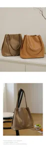 Vintage genuine leather bucket bag large capacity commuter tote handbag for women elegant style.