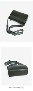Dark green genuine leather cylindrical crossbody bag with wide woven strap, chic pillow bag design.