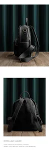 Detailed view of black genuine leather backpack, retro style, large capacity, premium material