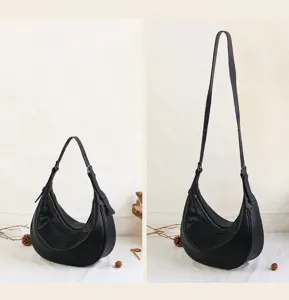 Stylish black leather crescent hobo bag for women, vintage retro shoulder crossbody bag.