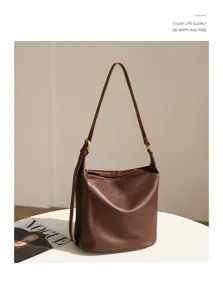 Casual large capacity hobo shoulder bag for women, stylish soft leather fashion tote detail.