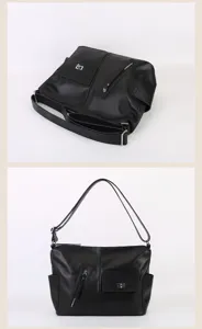 Detailed view of the black leather shoulder bag showcasing multi-pocket design details.