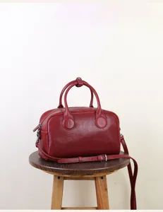 Trendy red leather Boston bag for women, vintage crossbody handbag with top handle.