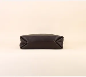 Dark brown leather soft bag detail view, casual minimalist design for daily commute.