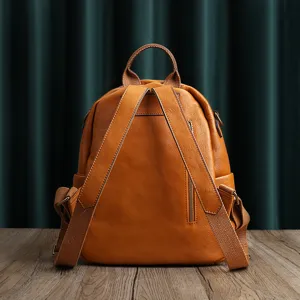 Vintage top layer cowhide leather backpack for women, large capacity travel school bag solid color.