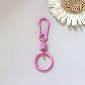 Pink zinc alloy spring keychain carabiner ring, ideal for car keys, belt loops, and bags.