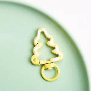 Close-up detail of the Christmas tree drip oil spring buckle alloy DIY jewelry accessory.
