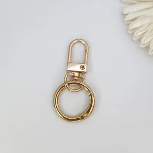 Gouden zinklegering sleutelring detail, draaibare veergesp hardware accessoire diy.