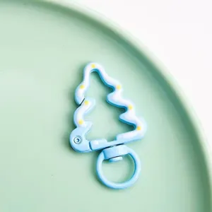 Detail view of the Christmas tree alloy spring snap hook charm for DIY jewelry and keychains.