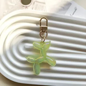 Cute jelly balloon dog keychain pendant, stylish green bag charm and creative gift ornament.