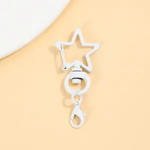 Witte ster draaibare karabijnhaak sleutelhanger DIY legering accessoire detailweergave