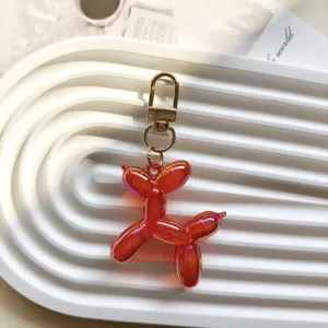 Red jelly balloon dog keychain pendant, cute resin bag charm and keyring accessory.