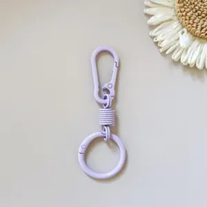 Close up view of the light purple zinc alloy spring keychain hook and round ring detail.