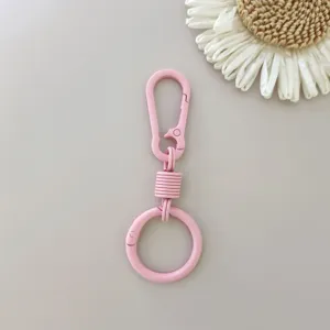 Pink zinc alloy spring keyring carabiner clip for car keys and bags, durable metal buckle.
