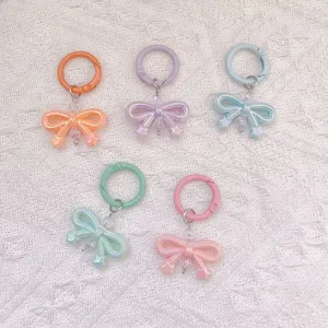 Cute pastel bow keychains with spring rings, translucent resin charms, bag and phone charms.