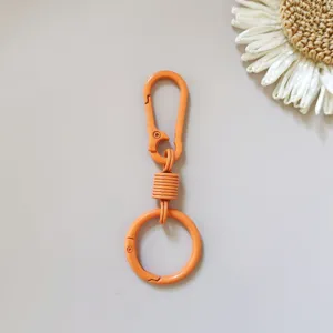 Orange zinc alloy spring keychain hook car waist hanging mountaineering ring buckle for bags.