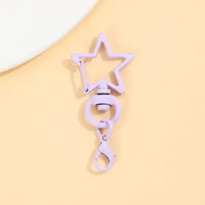 Paarse ster draaibare karabijnhaak sleutelhanger accessoire detailopname legering.