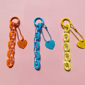 Handmade jelly acrylic heart keychain charm for DIY phone case and bag decoration.