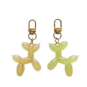 Cute jelly balloon dog keychain charm, glossy resin puppy pendant for bags and keys.
